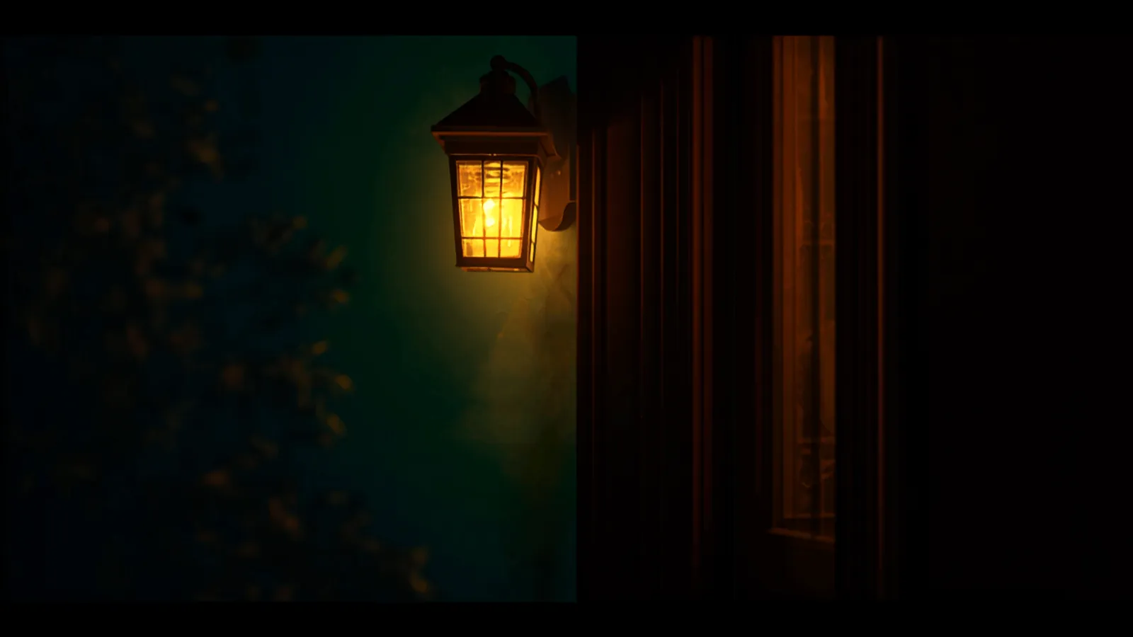 A porch light glowing beside a front door at night